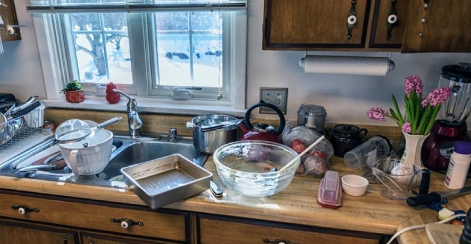 A cluttered, messy kitchen before cleaning